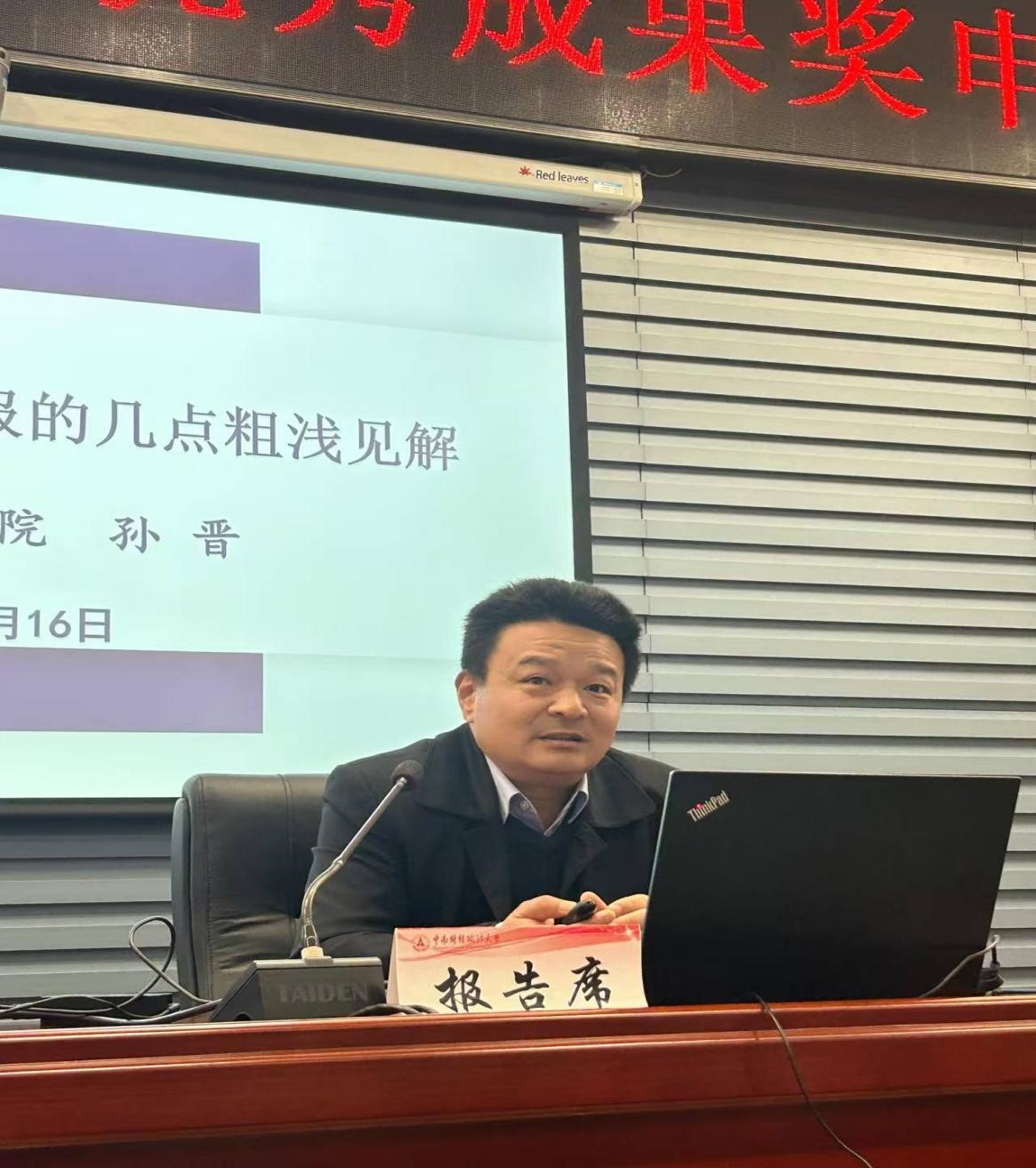 A person sitting at a desk with a computer AI-generated content may be incorrect.